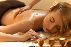 Body Scrub. Beautiful Blonde Gets a Salt Scrub Beauty Treatment in the spa Salon